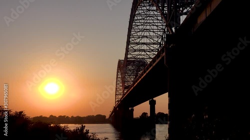 Sunset at the Hernando de Soto Bridge crossing the Mississippi River in Memphis, Tennessee. photo