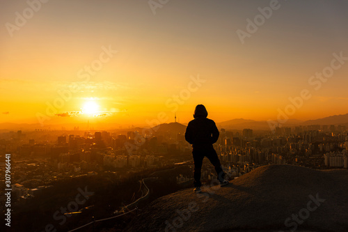 Shadow Man Standing Silhouette on background of Sunrise Sky
