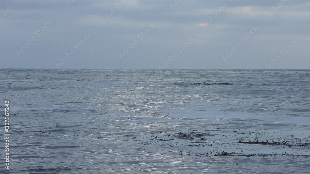 Rugged volcanic rocky shore in San Cristobal (or Chatham Island), the easternmost island in the Galapagos Archipelago, 2019 Rugged volcanic rocky shore in San Cristobal (or Chatham Island), the easternmost island in the Galapagos Archipelago, 2019