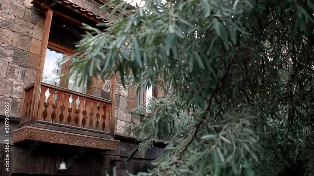 An Old Fashion Designed Building Exterior With A Tree By The Windows In Yuriy Gyumri, Armenia - Wide Shot An Old Fashion Designed Building Exterior With A Tree By The Windows In Yuriy Gyumri, Armenia - Wide Shot