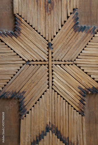 Fototapeta Naklejka Na Ścianę i Meble -  Vertical close up of rustic match stick art.