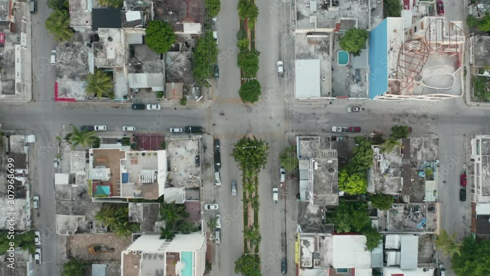 4k aerial Vertical View Following the Median Strip in beach town near Cancun 4k aerial Vertical View Following the Median Strip in beach town near Cancun