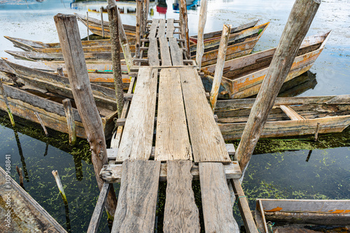 Muelle con sus botes o cayucos del  pueblo maya de San Antonio Palopó. photo