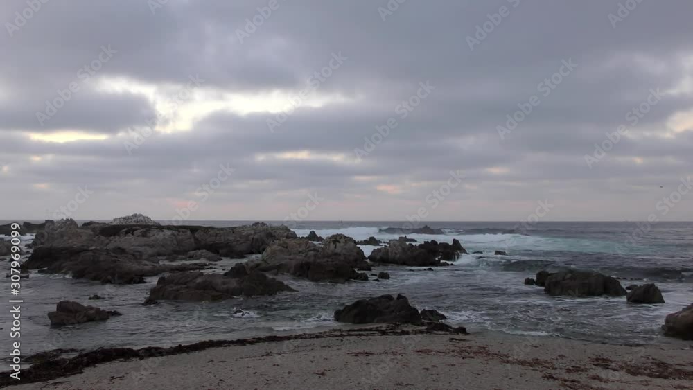 Rugged volcanic rocky shore in San Cristobal (or Chatham Island), the easternmost island in the Galapagos Archipelago, 2019 Rugged volcanic rocky shore in San Cristobal (or Chatham Island), the easternmost island in the Galapagos Archipelago, 2019