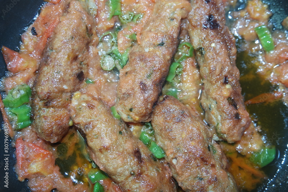 Delicious spicy home made fried kebab with green pepper Delicious spicy home made fried kebab with green pepper