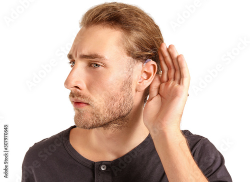 Young man with hearing aid ...
