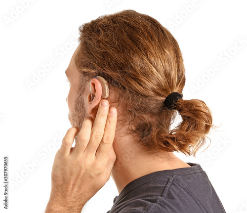 Young man with hearing aid ...