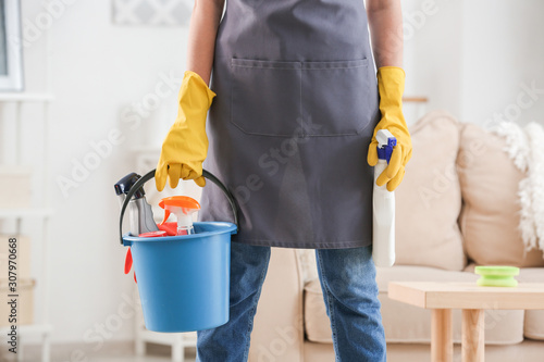 Female janitor with cleanin...