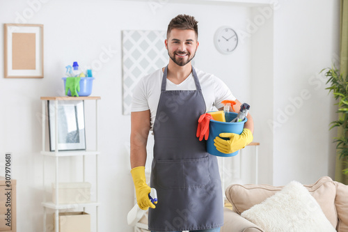 Male janitor with cleaning ...