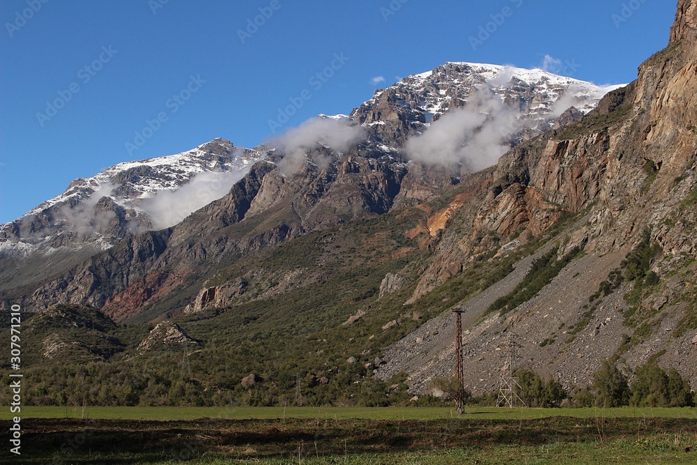Beautiful mountain landscape in Cajón del Maipo, Chile. Snowy mountain and valley in Chilean central Andes