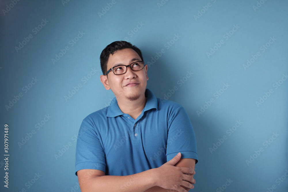 Young Man Thinking and Looking Up, Having Good Idea Young Man Thinking and Looking Up, Having Good Idea