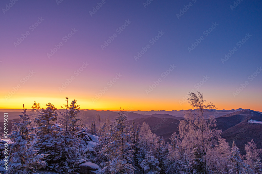 Sunrise on a frosty winter morning in the winter mountains Sunrise on a frosty winter morning in the winter mountains
