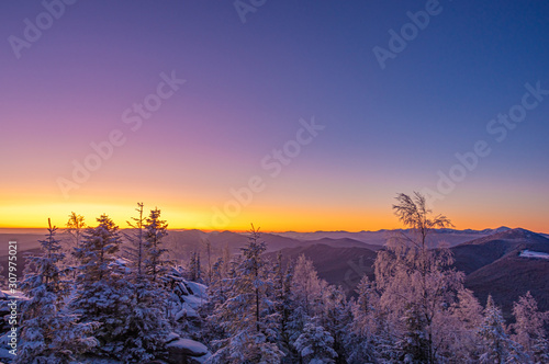 Sunrise on a frosty winter morning in the winter mountains
