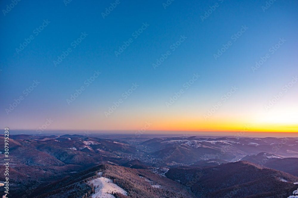 Sunrise on a frosty winter morning in the winter mountains