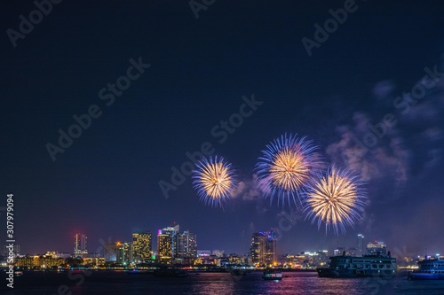 New Year's celebration fireworks in night city in Pattaya, Thailand.