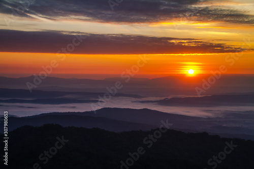Fototapeta Naklejka Na Ścianę i Meble -  sunrise with white fog in the mountains