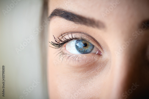 Fototapeta Naklejka Na Ścianę i Meble -  Macro photograph of a young woman's eye.