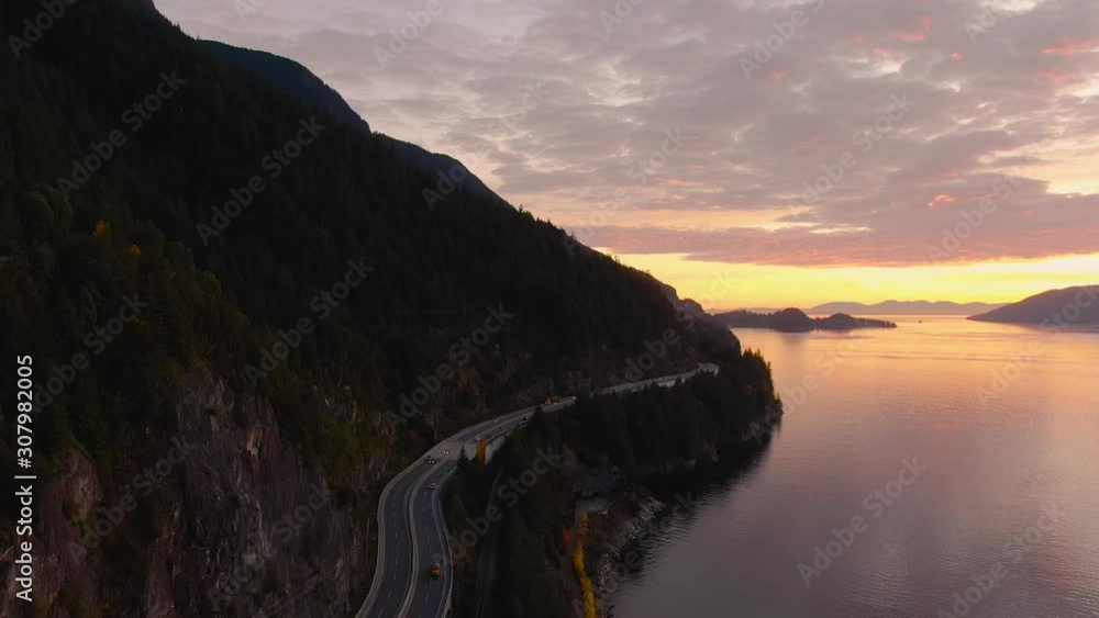 Sea to Sky Hwy in Howe Sound near Horseshoe Bay, West Vancouver, British Columbia, Canada. Aerial panoramic view during a colorful sunset in Fall Season. Sea to Sky Hwy in Howe Sound near Horseshoe Bay, West Vancouver, British Columbia, Canada. Aerial panoramic view during a colorful sunset in Fall Season.