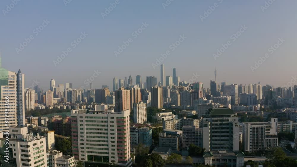Aerial dolly push back view of endless tall buildings & downtown skyscrapers of Guangzhou city, Guangdong, China. Aerial dolly push back view of endless tall buildings & downtown skyscrapers of Guangzhou city, Guangdong, China.