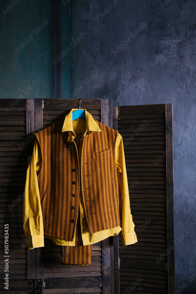 golden color. Yellow shirt, vest Stock 