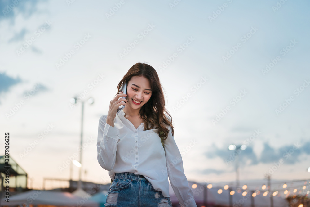 Young asia woman use smartphone.