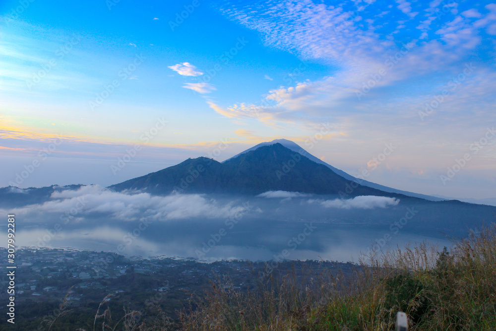 Morning view at Batur Mountain with fog and blue sky Morning view at Batur Mountain with fog and blue sky