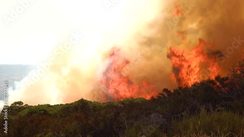 2019 - A vast scary fast moving wildifre burns brush on the hillsides of Southern California during the Cave Fire in Santa Barbara. photo