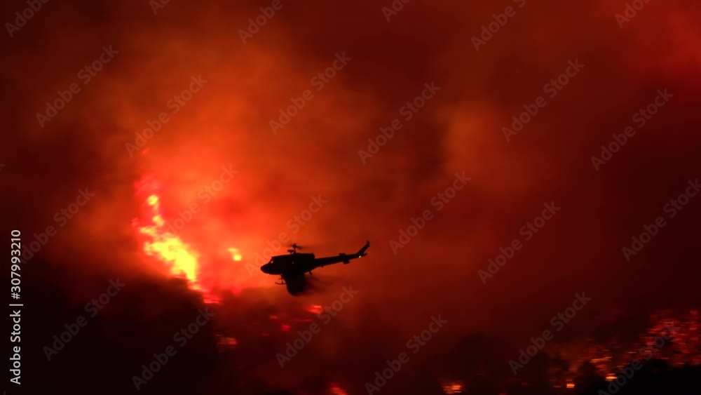 2019 - a helicopter makes a dramatic water drop at night responding to the Cave Fire near Santa Barbara, California. 2019 - a helicopter makes a dramatic water drop at night responding to the Cave Fire near Santa Barbara, California.
