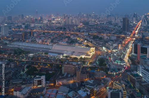 Aerial view (drone shot) of Bangkok Central Train Station with Downtown Skyline at night,Bangkok Thailand
