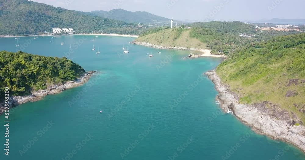4K drone aerial view, flight pass between mountain over the sea nearly Yanui beach in Phuket - Thailand, in sunny day 4K drone aerial view, flight pass between mountain over the sea nearly Yanui beach in Phuket - Thailand, in sunny day