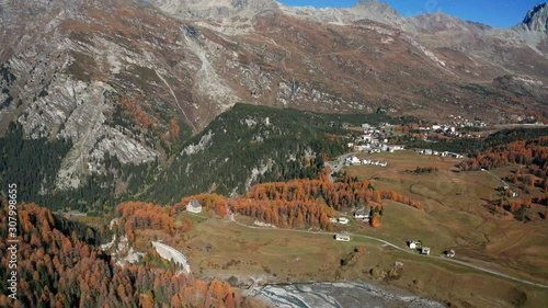 Aerial 4K - Val Bregaglia - Svizzera - Passo del Maloja - Vista autunnale di Maloggia  photo
