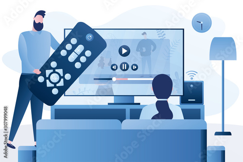 Love couple watch video with remote control and television multimedia box. Smart TV box, smart tv console
