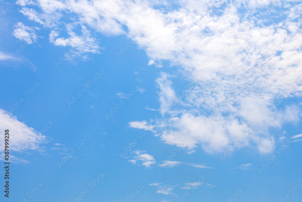 Blue sky and soft white clouds at day time for background.