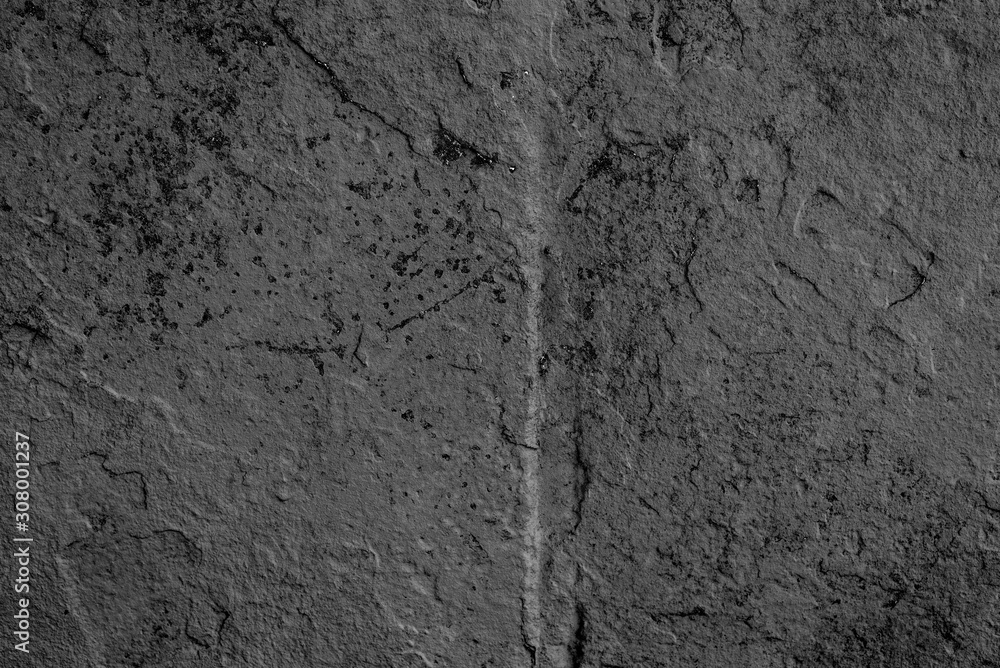 Fototapeta premium Texture of a concrete wall with cracks and scratches which can be used as a background
