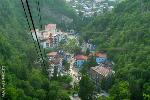 BORJOMI, GEORGIA - JUNE 27, 2019: One of the favorite tourist attractions in resort is the cable car ride over the Mineral Water Park and Borjomi photo