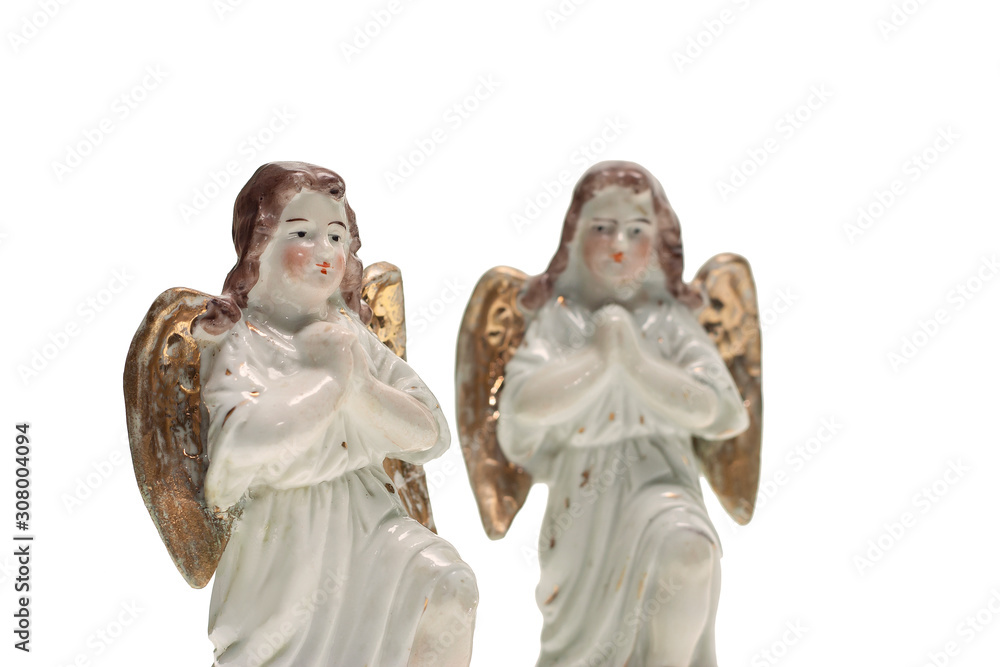 Two porcelain angels isolated on a white background
