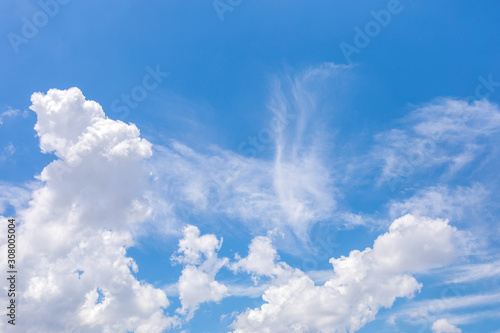 Blue sky and soft white clouds at day time for background. © Phongsak