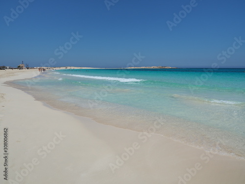 Marsa Matruh  Egypt. The sandy beach and the amazing sea with tropical blue  turquoise and green colors. Relaxing context. Fabulous holidays. Mediterranean Sea. North Africa. Clean and pristine sea