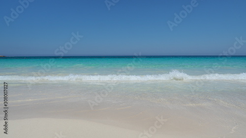 Marsa Matruh, Egypt. The sandy beach and the amazing sea with tropical blue, turquoise and green colors. Relaxing context. Fabulous holidays. Mediterranean Sea. North Africa. Clean and pristine sea