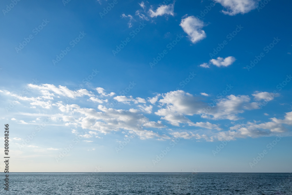 Landscape of sea horizon seascape under blue sky and cloud.