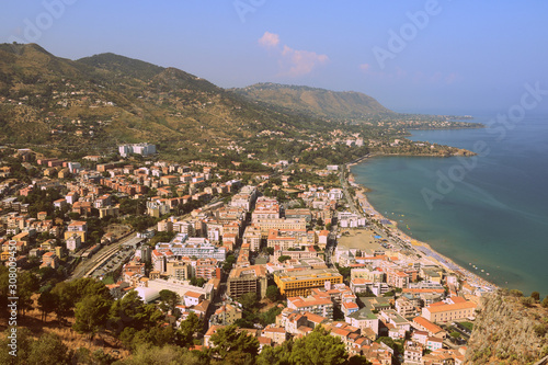 View of Cefalu town from the Rocca di Cefalu in early morning. Sicily, Italy. Retro style toned