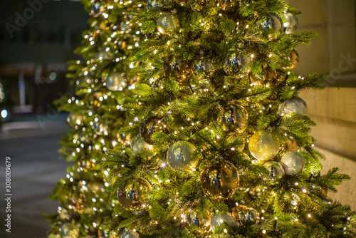 Colorful golden glass baubles and bokeh on a Christmas tree in Zurich - 1