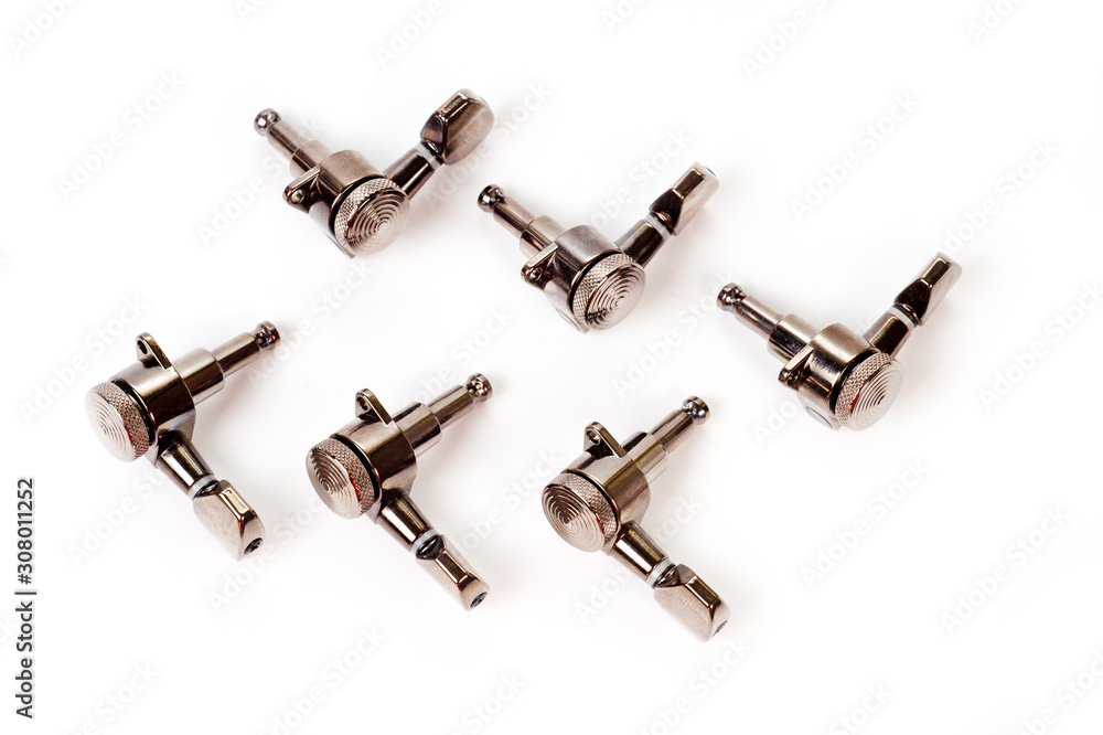 Machine heads.close up shot of electric and acoustic guitars on a white background Machine heads.close up shot of electric and acoustic guitars on a white background