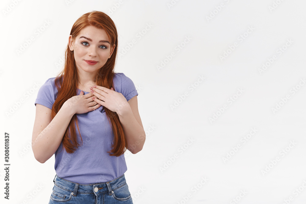 Cuteness, wellbeing and beauty concept. Silly tender young redhead woman with long hair in purple t-shirt, press hands to chest, heart, receive touching gift, smiling grateful, thanking for present Cuteness, wellbeing and beauty concept. Silly tender young redhead woman with long hair in purple t-shirt, press hands to chest, heart, receive touching gift, smiling grateful, thanking for present