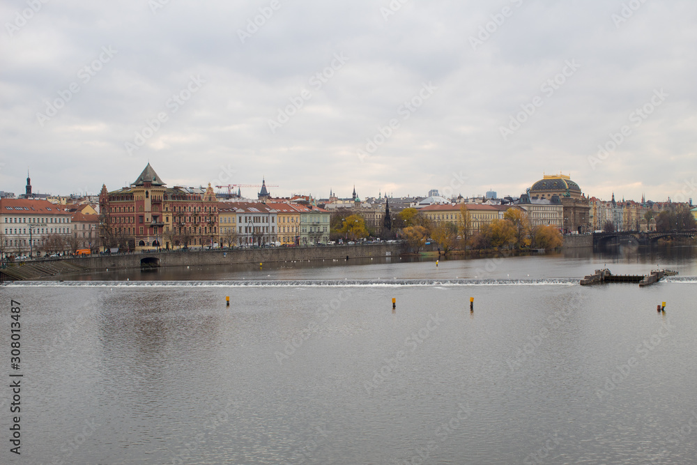 Fototapeta premium Cityscape of the Czech capital Prague and the Vltava river. View of Charles Bridge and Prague Castle on Christmas Eve.