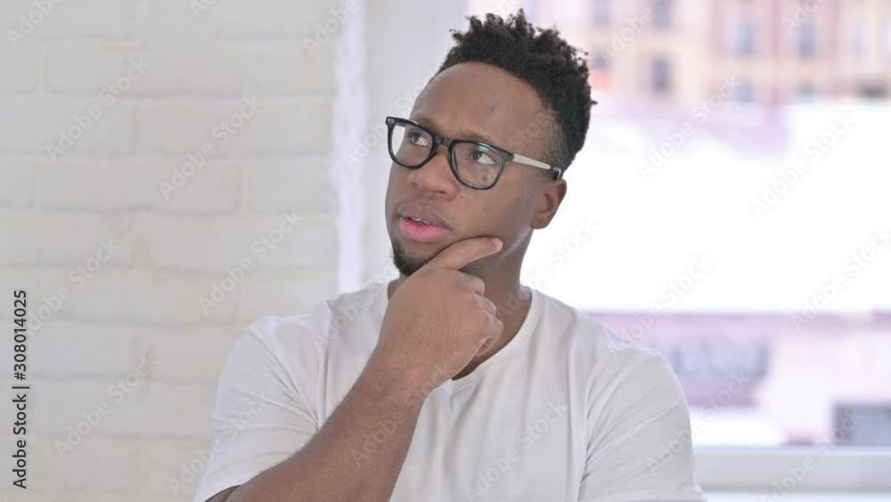 Portrait of Thoughtful Casual African Man Thinking Portrait of Thoughtful Casual African Man Thinking