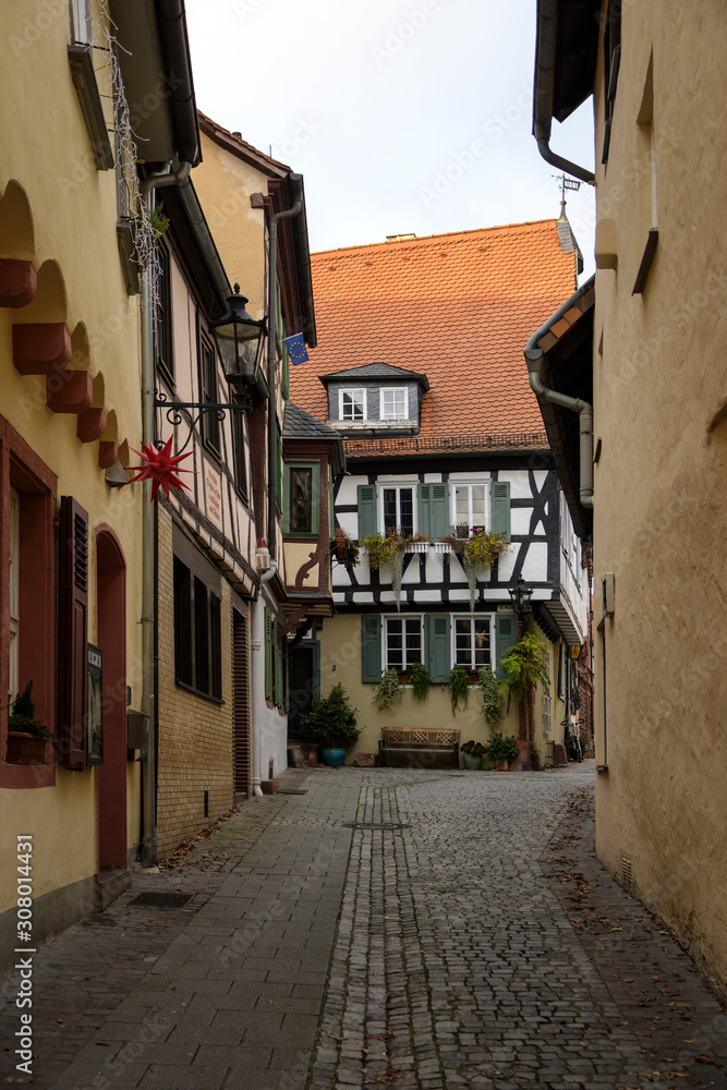 Narrow alley with historical half-timbered houses in the old town of Aschaffenburg, north Bavaria, Germany