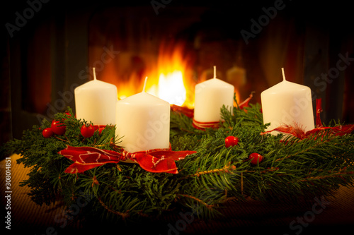 Christmas Wreath on the fireplace background.