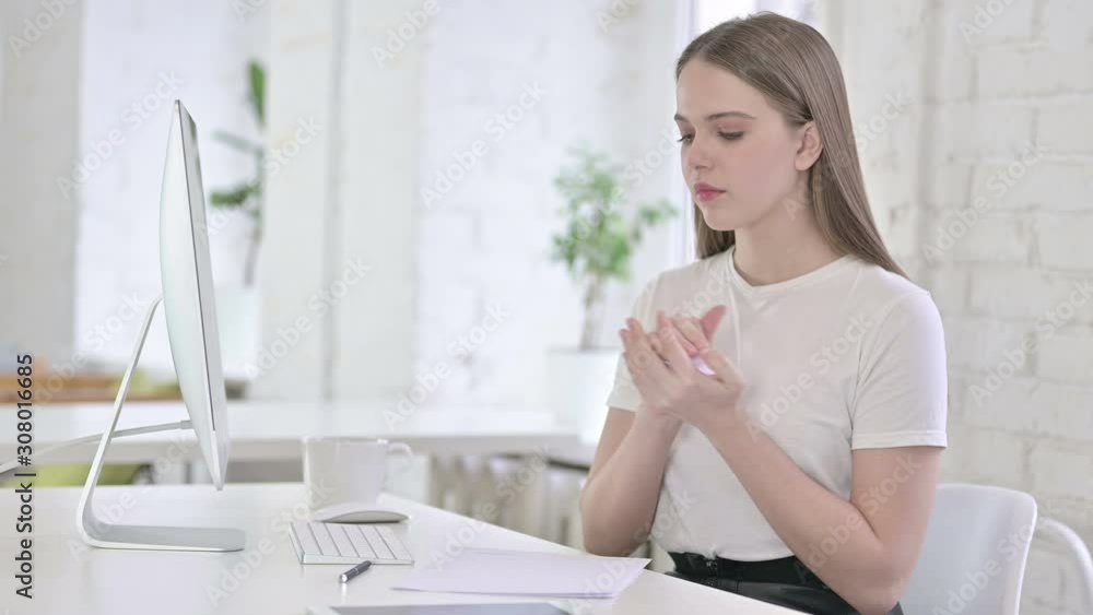 Disappointed Young Woman Trying to Write on Paper Disappointed Young Woman Trying to Write on Paper