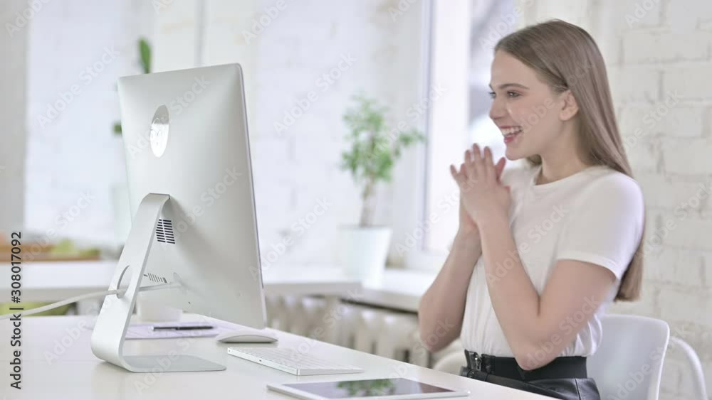 Ambitious Young Woman Celebrating Success in Office Ambitious Young Woman Celebrating Success in Office